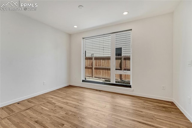 1231 Newton St, Denver, CO 80204 - spare room featuring light wood-style flooring and recessed lighting