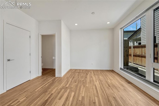 1231 Newton St, Denver, CO 80204 - spare room with light wood-style floors and recessed lighting