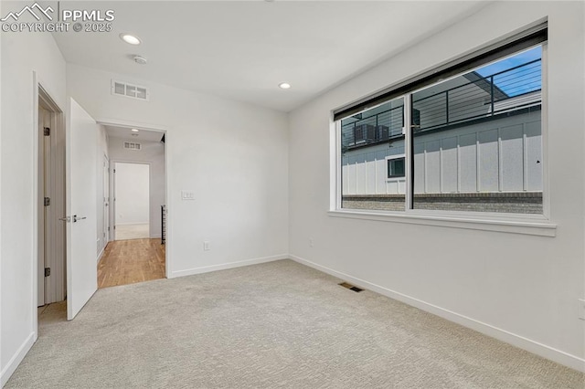 1231 Newton St, Denver, CO 80204 - carpeted spare room with baseboards and recessed lighting