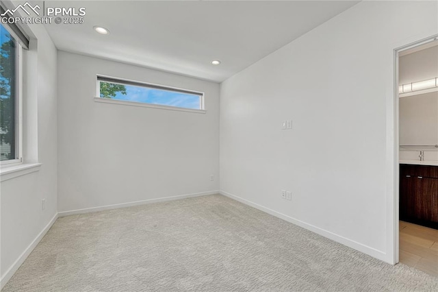 1231 Newton St, Denver, CO 80204 - empty room with recessed lighting and light carpet