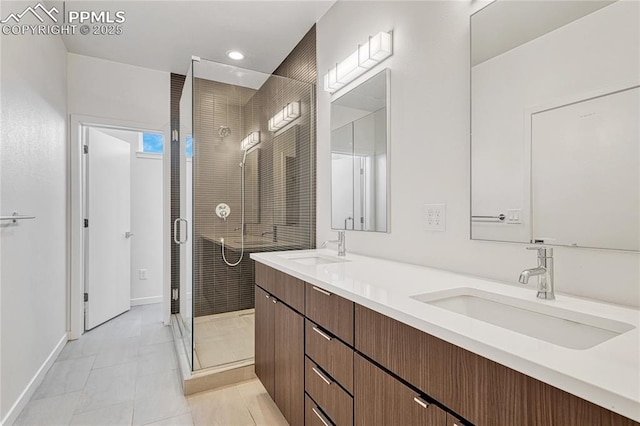 1231 Newton St, Denver, CO 80204 - full bath with a shower stall, double vanity, tile patterned floors, and recessed lighting