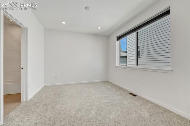 1231 Newton St, Denver, CO 80204 - spare room with carpet floors and recessed lighting
