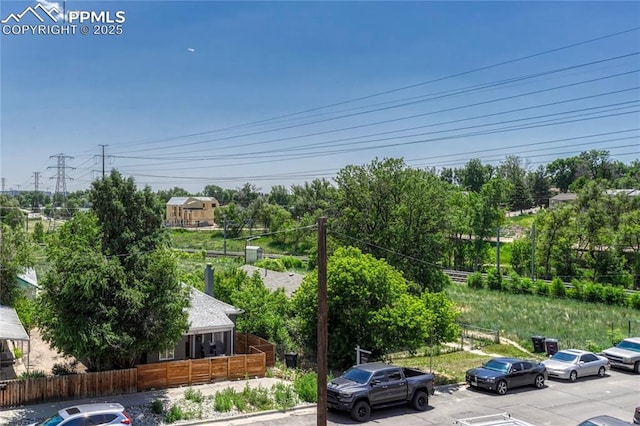 1231 Newton St, Denver, CO 80204 - view of car parking with view of wooded area