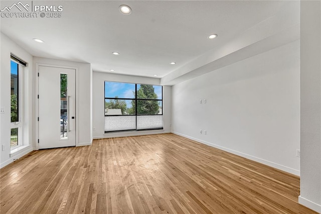 1231 Newton St, Denver, CO 80204 - empty room featuring light wood-type flooring and recessed lighting