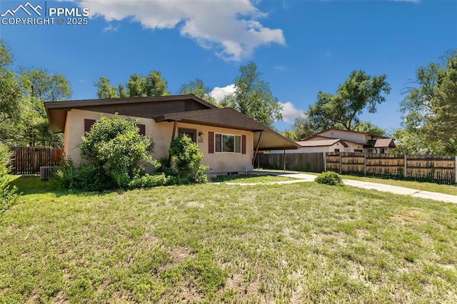 1443 Luna Dr, Fountain, CO 80817 - rear view of house with an attached carport and driveway