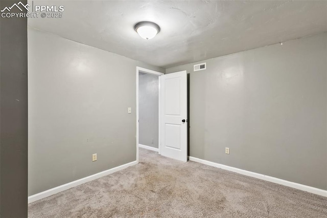 1443 Luna Dr, Fountain, CO 80817 - spare room featuring carpet and baseboards