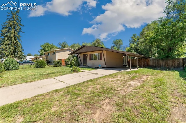1443 Luna Dr, Fountain, CO 80817 - view of front of house with concrete driveway and a carport