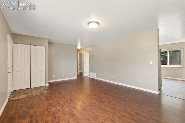 1443 Luna Dr, Fountain, CO 80817 - unfurnished bedroom with wood finished floors and a closet