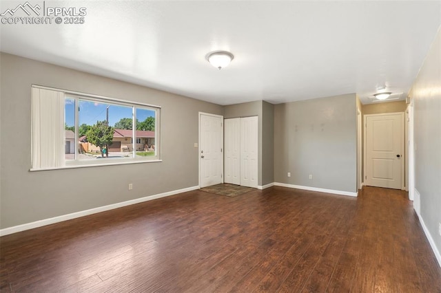 1443 Luna Dr, Fountain, CO 80817 - unfurnished bedroom with wood finished floors and baseboards