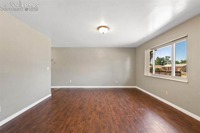 1443 Luna Dr, Fountain, CO 80817 - unfurnished room featuring baseboards and wood finished floors
