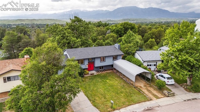 7030 Metropolitan St, Colorado Springs, CO 80911 - aerial view of property and surrounding area featuring a mountainous background