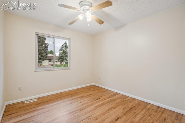 7030 Metropolitan St, Colorado Springs, CO 80911 - unfurnished room with wood finished floors, a textured ceiling, and ceiling fan