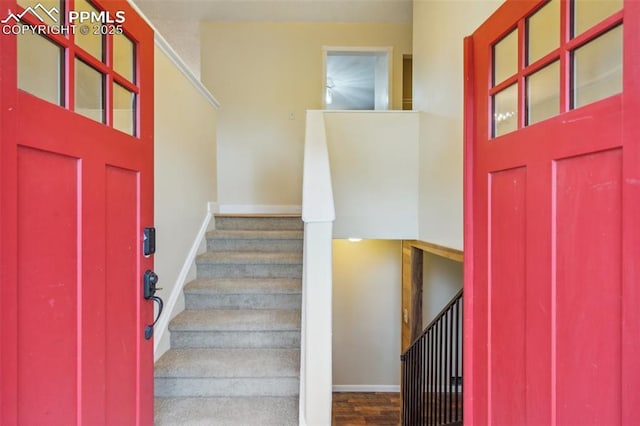 7030 Metropolitan St, Colorado Springs, CO 80911 - foyer featuring baseboards and stairway