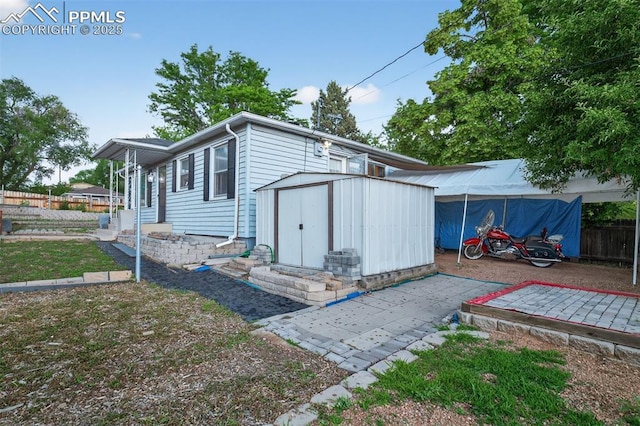 822 W Monroe St, Colorado Springs, CO 80907 - rear view of house with a shed and a patio area