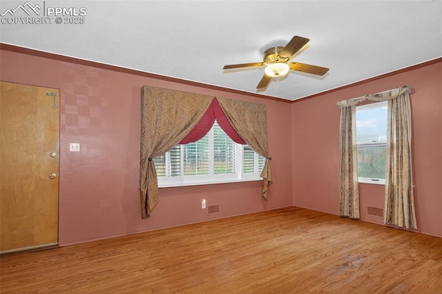 822 W Monroe St, Colorado Springs, CO 80907 - empty room featuring wood finished floors, a ceiling fan, and crown molding
