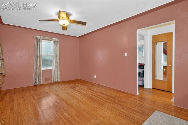 822 W Monroe St, Colorado Springs, CO 80907 - unfurnished room with wood finished floors and a ceiling fan