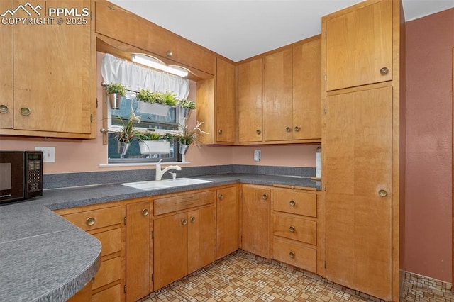822 W Monroe St, Colorado Springs, CO 80907 - kitchen featuring black microwave, dark countertops, and brown cabinets