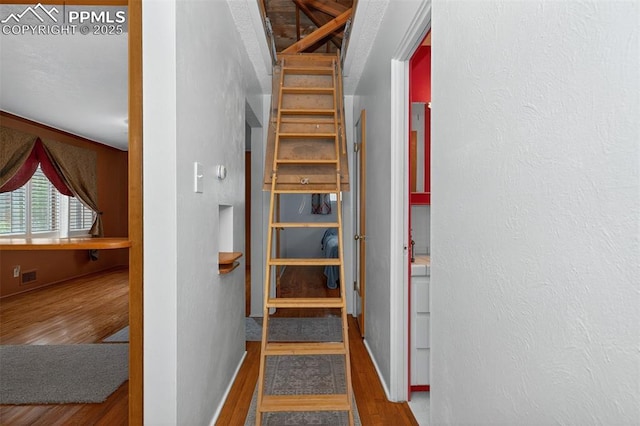 822 W Monroe St, Colorado Springs, CO 80907 - staircase featuring wood finished floors