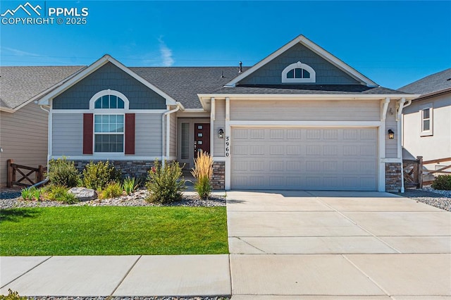 5960 Bennach Grv, Colorado Springs, CO 80927 - view of front facade featuring stone siding, a garage, concrete driveway, and a front lawn