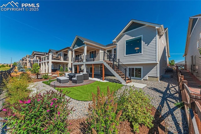 5960 Bennach Grv, Colorado Springs, CO 80927 - back of property with an outdoor hangout area, stairs, a patio, and a fenced backyard