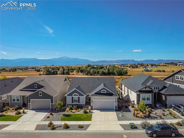 5960 Bennach Grv, Colorado Springs, CO 80927 - view of front of home with a mountain view, driveway, and a residential view