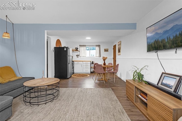 3619 Regis St, Colorado Springs, CO 80909 - living room featuring dark wood-style flooring