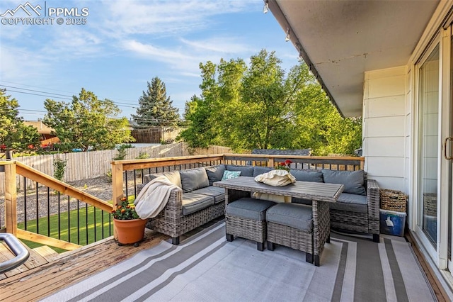 3619 Regis St, Colorado Springs, CO 80909 - wooden deck with an outdoor hangout area and a fenced backyard