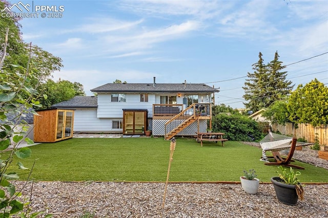 3619 Regis St, Colorado Springs, CO 80909 - back of property with a deck, stairway, and french doors