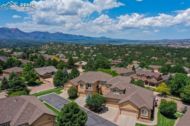 5775 Sonnet Hts, Colorado Springs, CO 80918 - aerial perspective of suburban area with a mountain backdrop