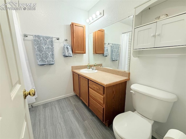 2160 Ance St, Strasburg, CO 80136 - bathroom featuring vanity and wood finished floors