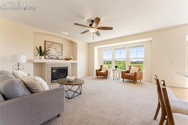 9891 Red Sage Dr, Colorado Springs, CO 80920 - living area with a ceiling fan, a fireplace, and carpet flooring