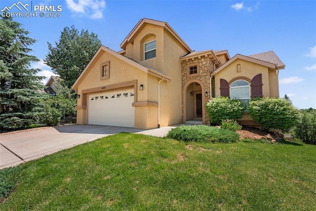 9891 Red Sage Dr, Colorado Springs, CO 80920 - mediterranean / spanish-style home featuring stucco siding, a garage, a front lawn, and driveway