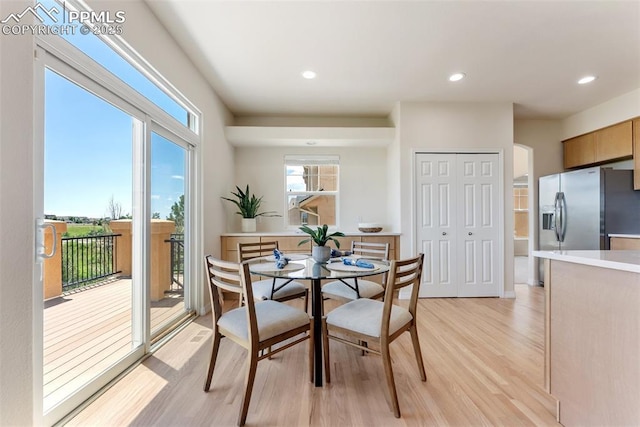 9891 Red Sage Dr, Colorado Springs, CO 80920 - dining space featuring light wood finished floors and recessed lighting