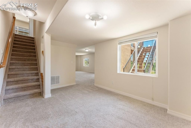 9891 Red Sage Dr, Colorado Springs, CO 80920 - staircase featuring carpet floors and baseboards