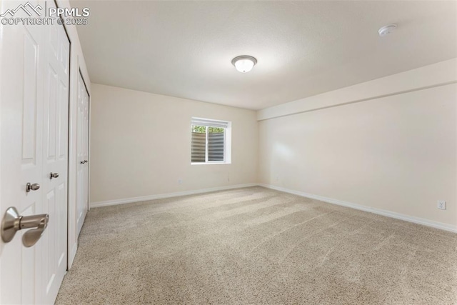9891 Red Sage Dr, Colorado Springs, CO 80920 - unfurnished bedroom with light colored carpet and baseboards