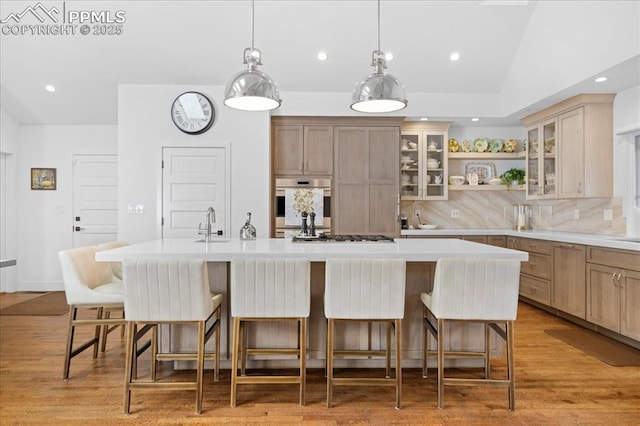 18 2nd St, Colorado Springs, CO 80906 - kitchen with light countertops, stainless steel appliances, tasteful backsplash, open shelves, and recessed lighting