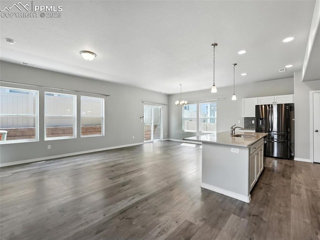 6222 Barr Pt, Colorado Springs, CO 80924 - kitchen featuring stainless steel fridge with ice dispenser, a chandelier, white cabinets, an island with sink, and recessed lighting