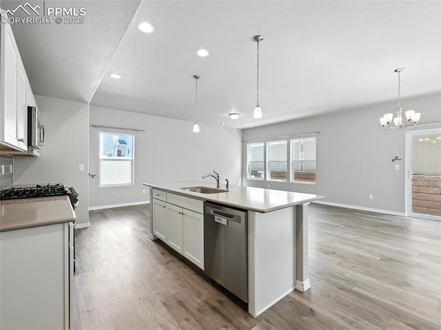 6222 Barr Pt, Colorado Springs, CO 80924 - kitchen with stainless steel appliances, white cabinetry, light countertops, light wood-style flooring, and recessed lighting