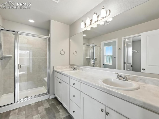 6222 Barr Pt, Colorado Springs, CO 80924 - full bath with a shower stall, double vanity, and recessed lighting