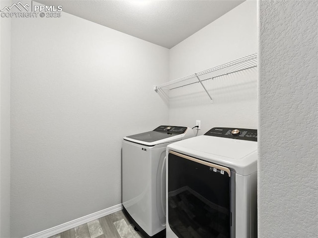 6222 Barr Pt, Colorado Springs, CO 80924 - laundry area featuring washer and dryer and light wood-type flooring