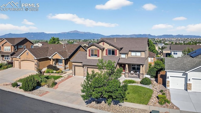 6372 Shooting Iron Way, Colorado Springs, CO 80923 - view of front of property with a residential view, driveway, covered porch, and a mountain view