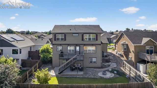 6372 Shooting Iron Way, Colorado Springs, CO 80923 - rear view of property featuring a residential view, a patio, a fenced backyard, and stairs