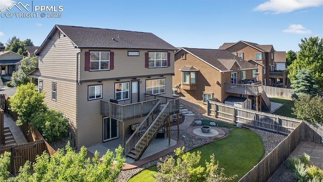 6372 Shooting Iron Way, Colorado Springs, CO 80923 - back of house featuring stairway, a patio, a fenced backyard, a wooden deck, and a residential view