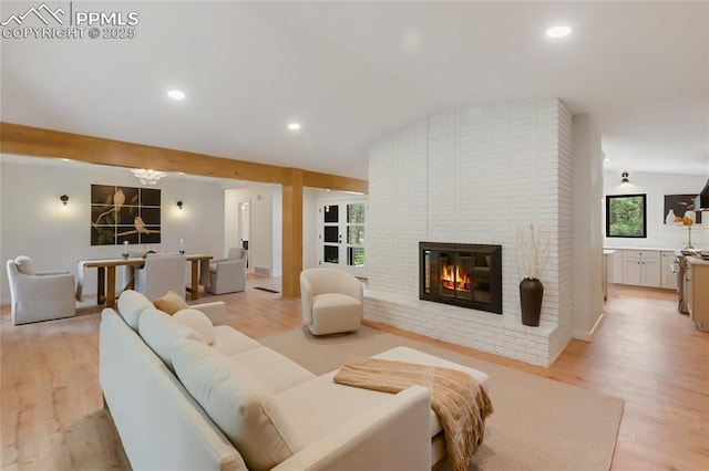 1320 Spring Valley Dr, Colorado Springs, CO 80921 - living room featuring light wood finished floors, a fireplace, and recessed lighting
