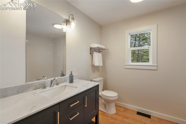 1320 Spring Valley Dr, Colorado Springs, CO 80921 - bathroom featuring wood finished floors and vanity