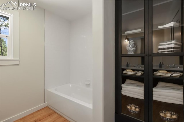 1320 Spring Valley Dr, Colorado Springs, CO 80921 - bathroom with wood finished floors and a bath