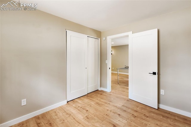 1320 Spring Valley Dr, Colorado Springs, CO 80921 - unfurnished bedroom with light wood finished floors and a closet