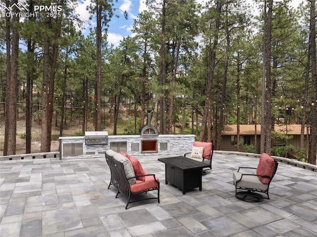 1320 Spring Valley Dr, Colorado Springs, CO 80921 - view of patio / terrace with area for grilling and an outdoor fire pit