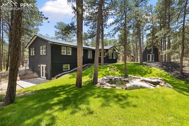 1320 Spring Valley Dr, Colorado Springs, CO 80921 - view of front of house with a front lawn and stucco siding