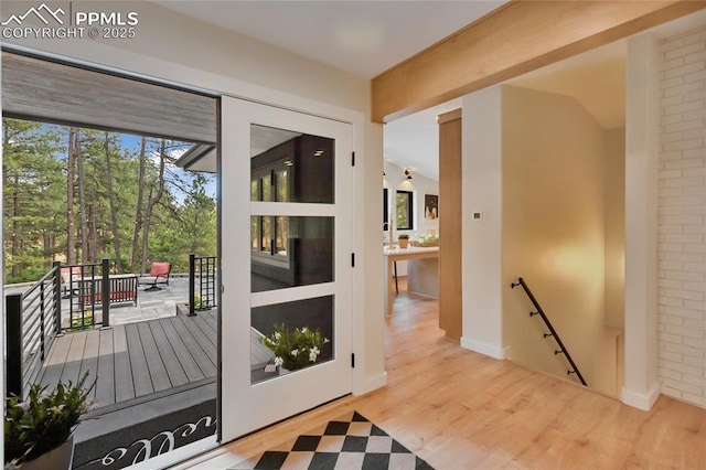 1320 Spring Valley Dr, Colorado Springs, CO 80921 - doorway featuring healthy amount of natural light and wood finished floors
